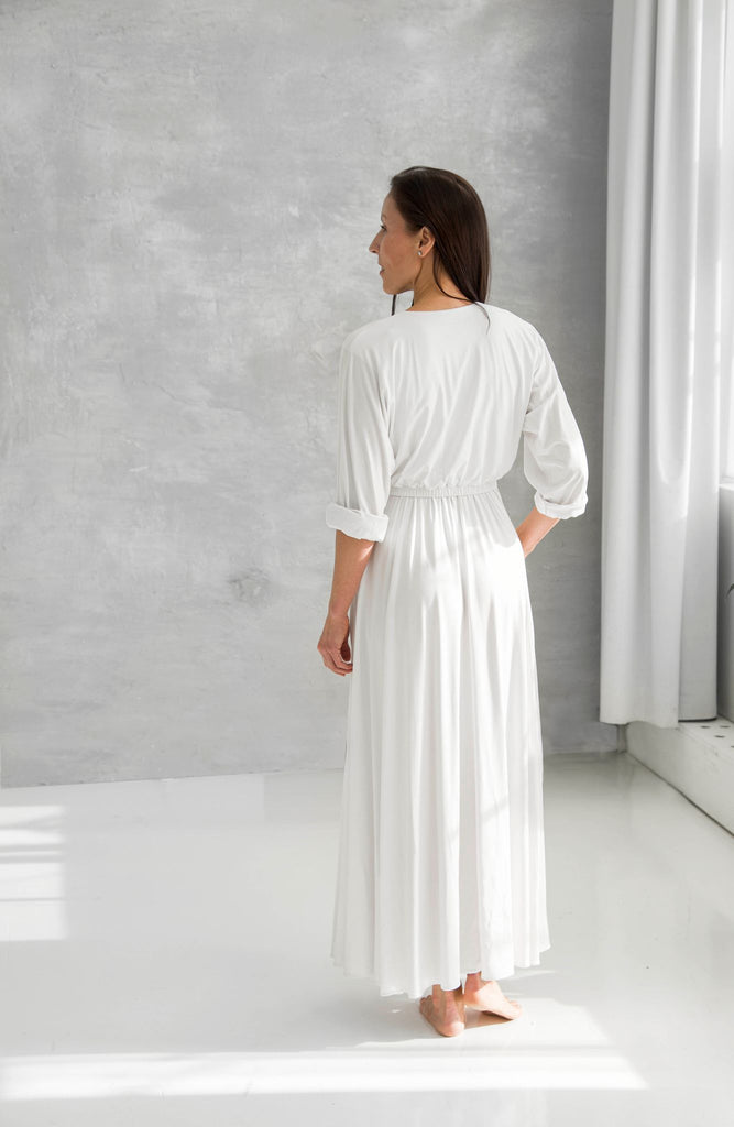 Rachel Ackley in organic cotton button down ankle long dress in white back view