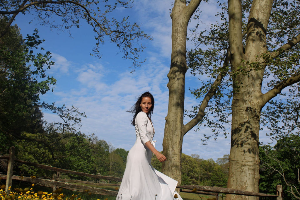 Rachel Ackley in organic cotton ankle long healer dress in white in the park