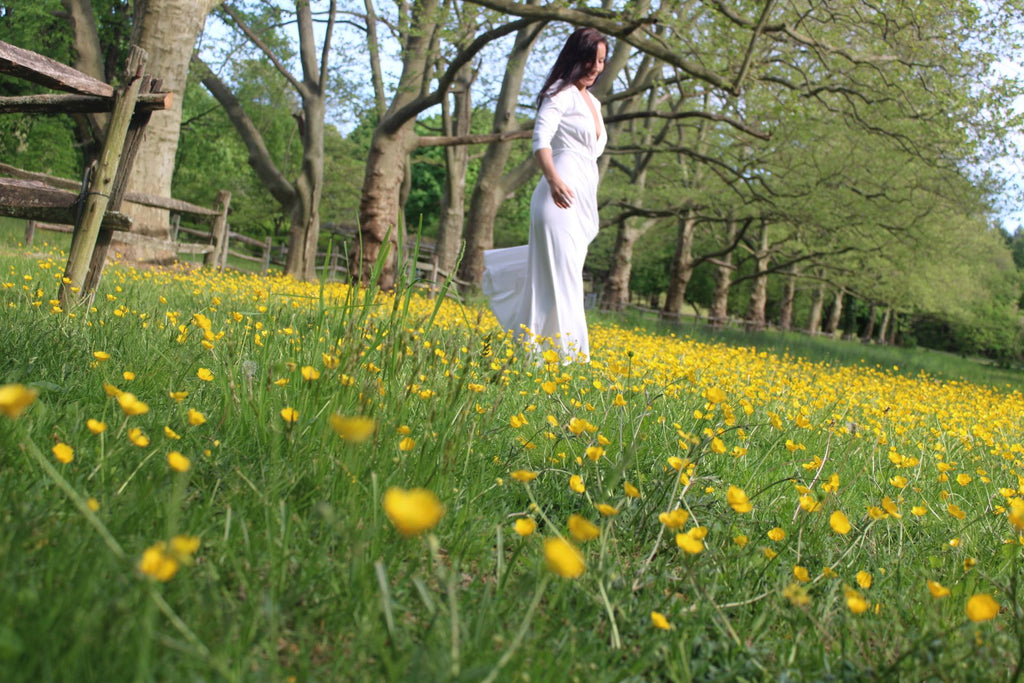 Rachel Ackley in organic cotton ankle long healer dress in white in the park