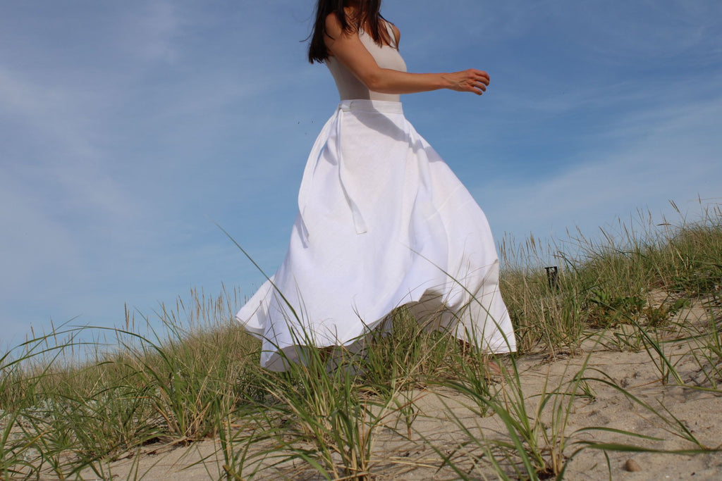 Rachel Ackley in linen healer skirt in white on the beach